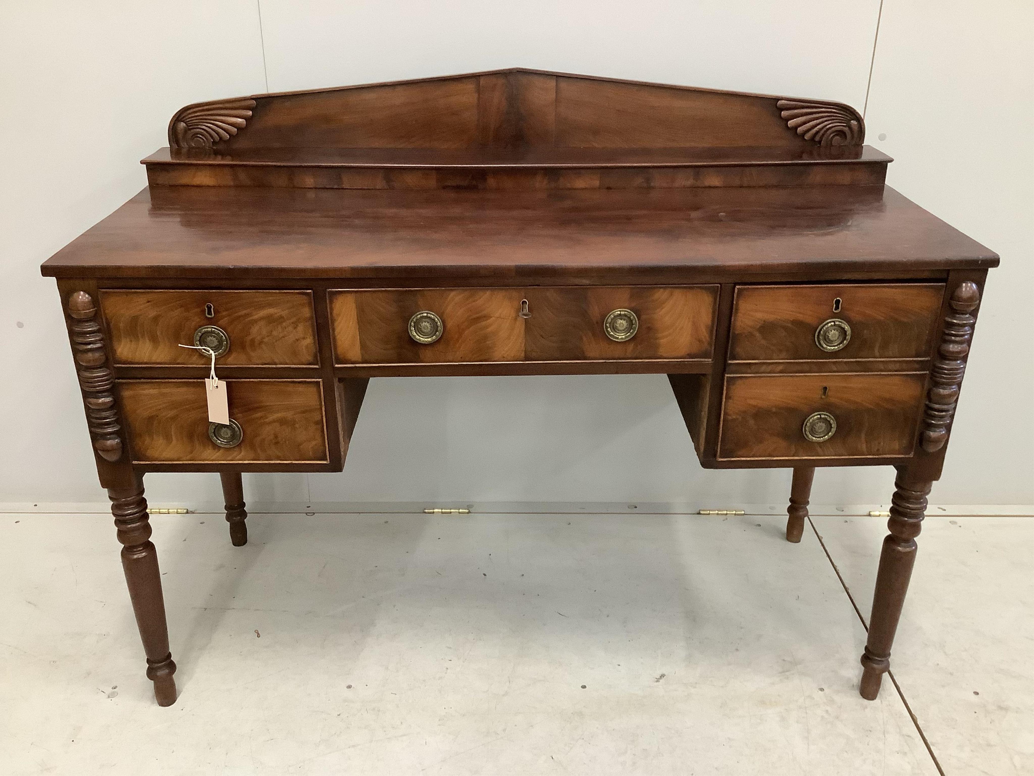 A Regency mahogany sideboard, width 126cm, depth 58cm, height 103cm. Condition - fair but missing two pieces of moulding to kneehole